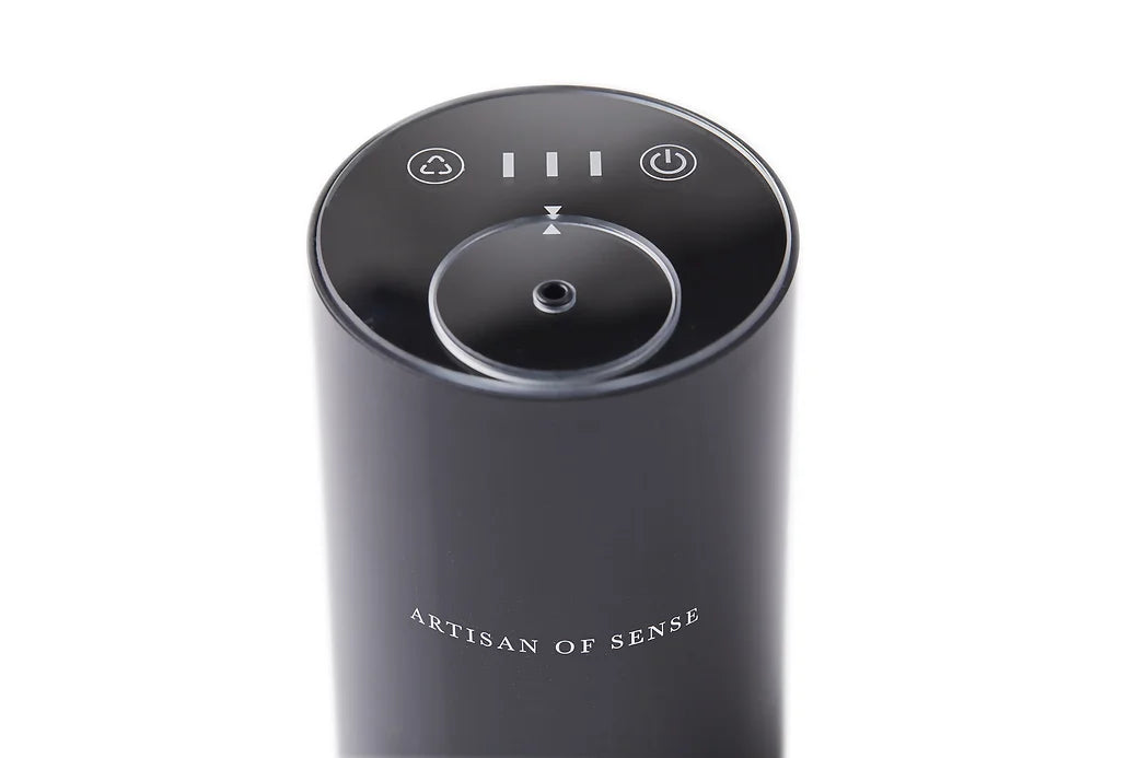 Portable ultrasonic diffuser set in Pink, White, or Black, includes AOS Essential Oil Blend for on-the-go aromatherapy.