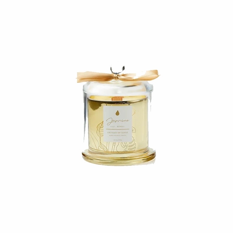 Imagine the ambiance created by this soy candle with natural fragrances and crackling FSC wooden wick, beautifully displayed in a golden glass jar and covered by a clear cloche. A sustainable and delightful gift option. Scent: Jasmine . Lily . Neroli.