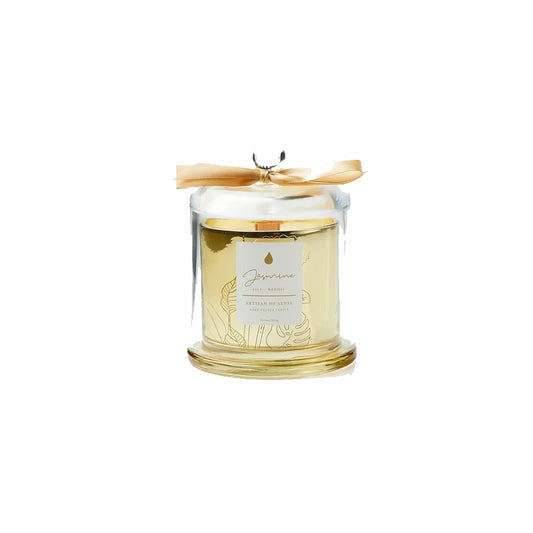 Imagine the ambiance created by this soy candle with natural fragrances and crackling FSC wooden wick, beautifully displayed in a golden glass jar and covered by a clear cloche. A sustainable and delightful gift option. Scent: Jasmine . Lily . Neroli.