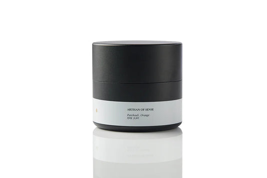 Compact tin candle with natural Patchouli Orange fragrance, cotton wick, for home comfort on the go. Offering a sensory journey for relaxation.