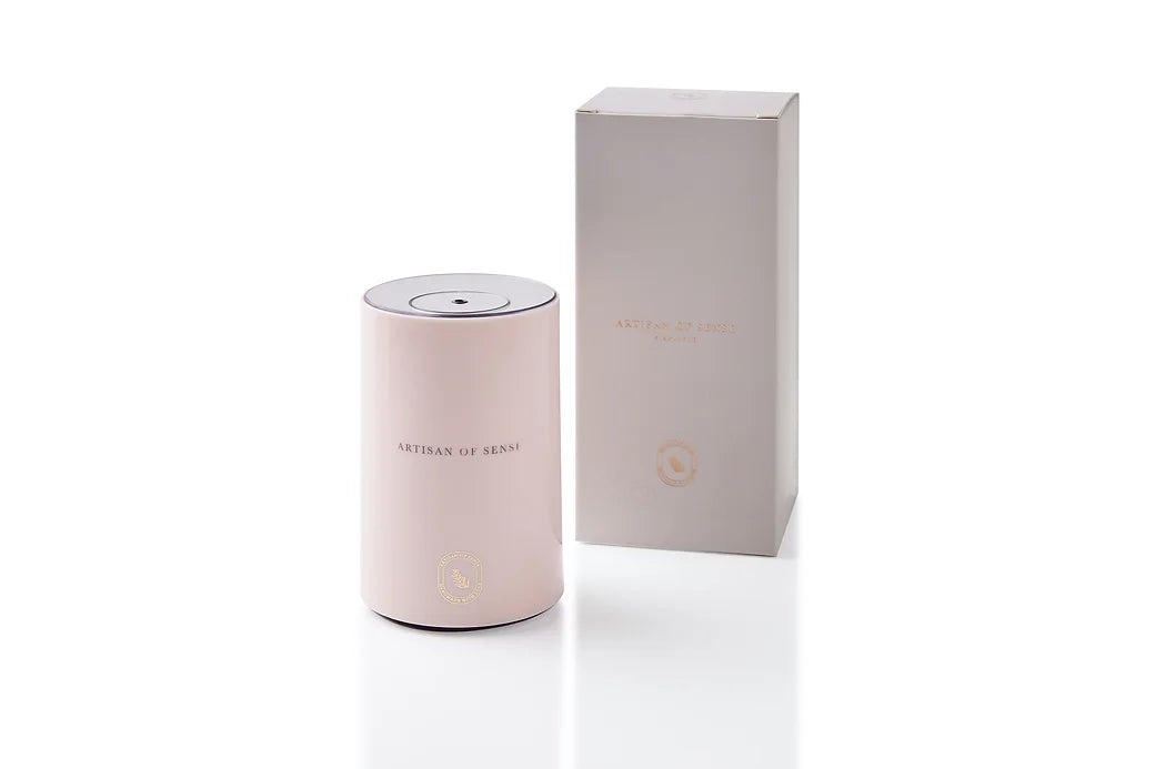 Portable ultrasonic diffuser set in Pink, White, or Black, includes AOS Essential Oil Blend for on-the-go aromatherapy.
