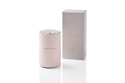 Portable ultrasonic diffuser set in Pink, White, or Black, includes AOS Essential Oil Blend for on-the-go aromatherapy.
