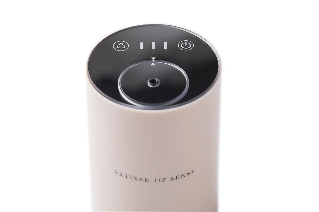 Portable ultrasonic diffuser set in Pink, White, or Black, includes AOS Essential Oil Blend for on-the-go aromatherapy.