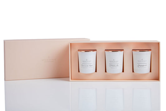 Elegant gift set containing three natural scented candles for a sensory experience.