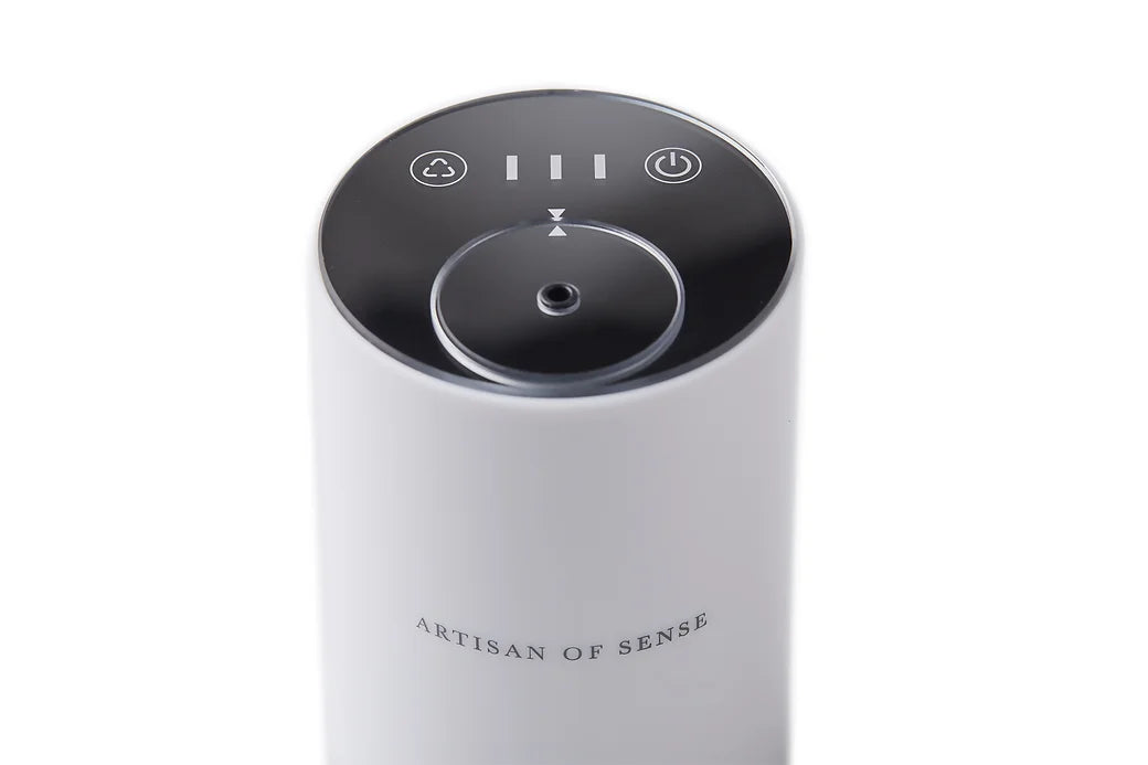 Portable ultrasonic diffuser set in Pink, White, or Black, includes AOS Essential Oil Blend for on-the-go aromatherapy.