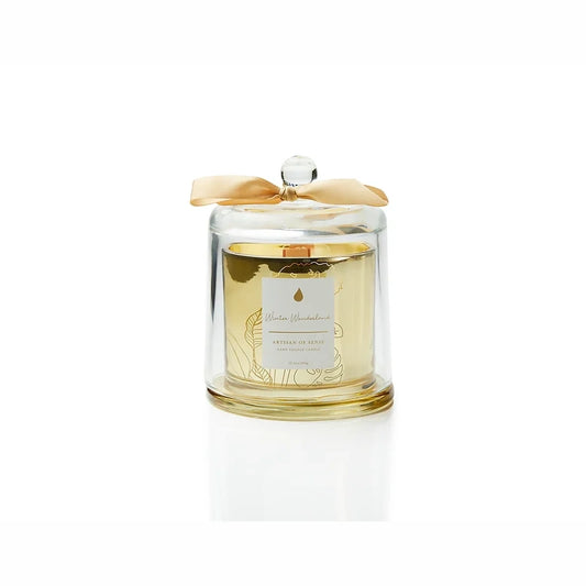 Discover the charm of a crackling wooden wick candle with natural fragrances, a hand-crafted soy creation nestled in a chic gold glass jar and covered by a glass cloche. Its unique aesthetic and eco-friendly packaging make it an excellent gift choice. Scent: Winter Wonderland.