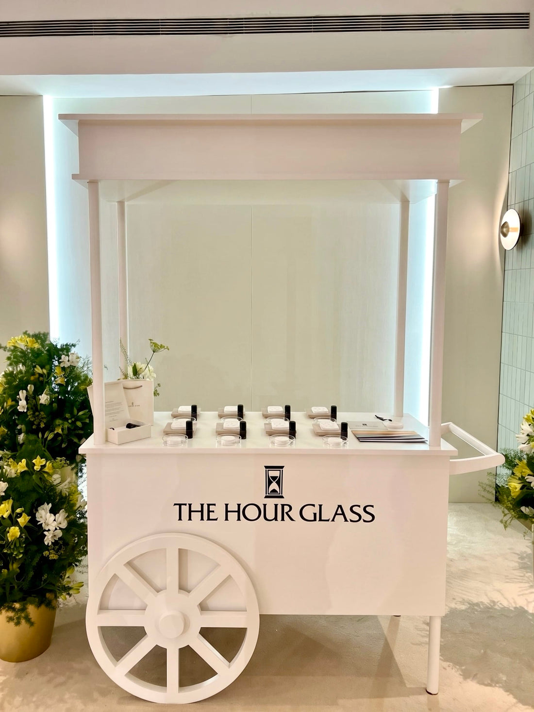 The Alchemist's Atelier custom white push-cart mobile fragrance bar activation for luxury corporate client events in Singapore by Artisan of Sense.
