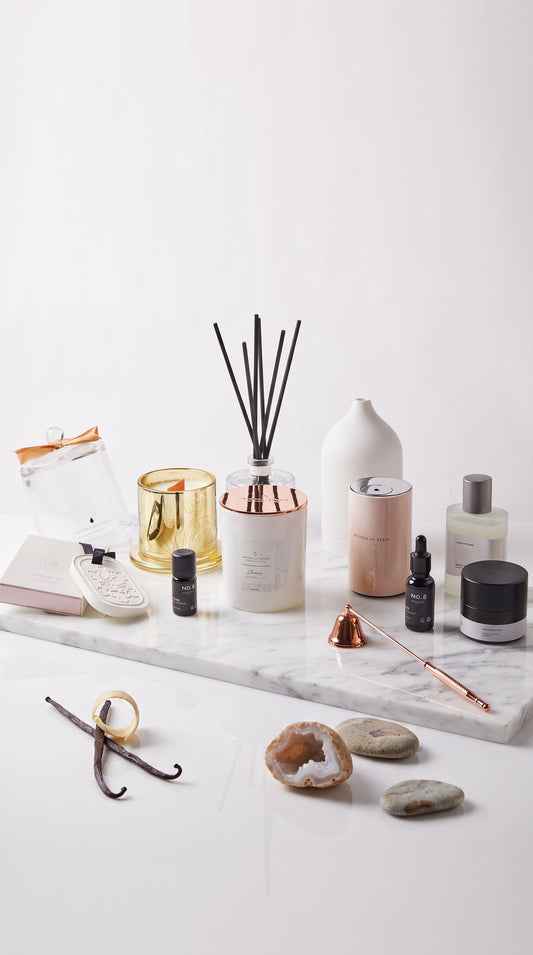 Full range of private label botanical products including luxury soy candles, reed diffusers, electronic nebulizers, ceramic scent stones, and room mists, representing custom fragrance OEM capabilities in Singapore by Artisan of Sense.