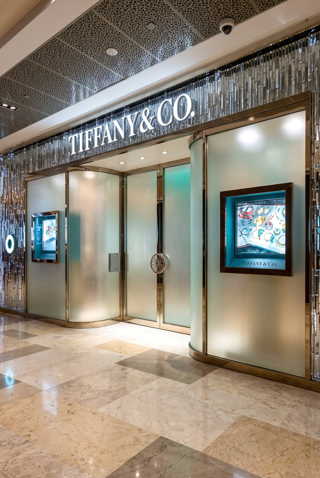 High-end luxury retail store facade representing discreet spatial scenting architecture for the Tiffany & Co. Blue Box Cafe in Singapore, curated by Artisan of Sense.