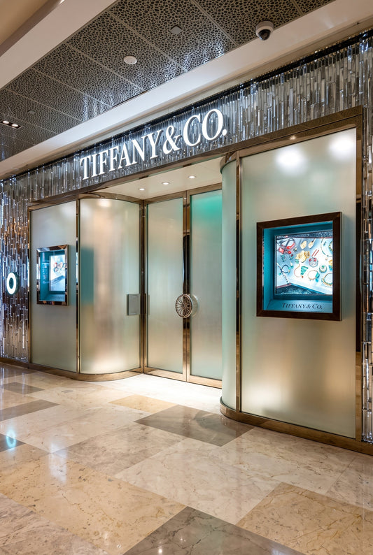 High-end luxury retail store facade representing discreet spatial scenting architecture for the Tiffany & Co. Blue Box Cafe in Singapore, curated by Artisan of Sense.