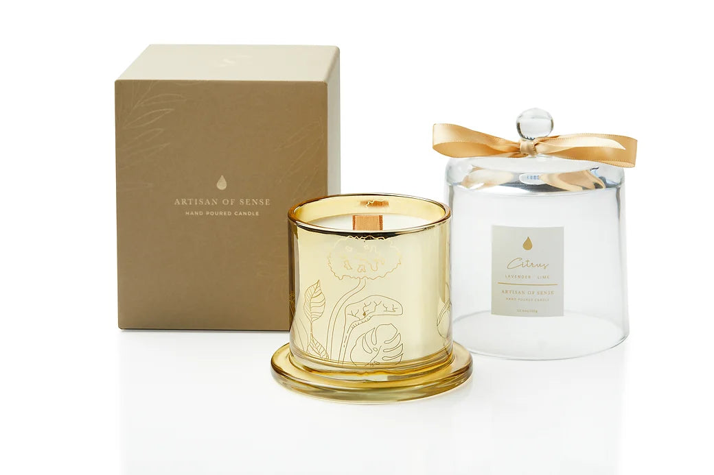 Experience the subtle crackle of this handcrafted soy candle, complete with an FSC wooden wick and housed in a stylish gold glass jar with a cloche. Eco-conscious packaging makes it a thoughtful gift. Scent: Citrus . Lavender . Lime.