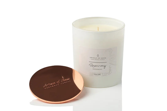 Hand-poured Rosemary & Peppermint Soy Candle, cotton wick, long-lasting, with sustainable packaging.
