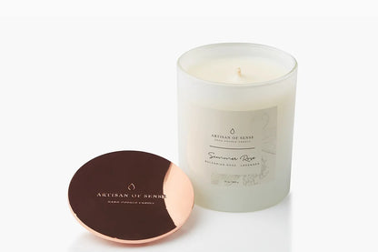 Two sizes of natural Vanilla Sky Soy candle with cotton wicks, in classic pink packaging.
