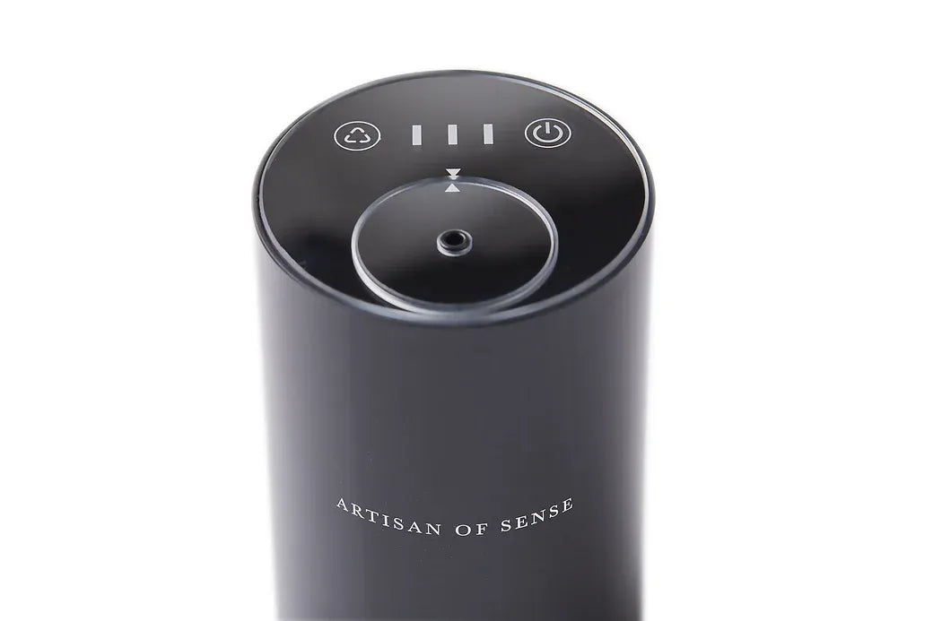 Portable ultrasonic diffuser set in Pink, White, or Black, includes AOS Essential Oil Blend for on-the-go aromatherapy.