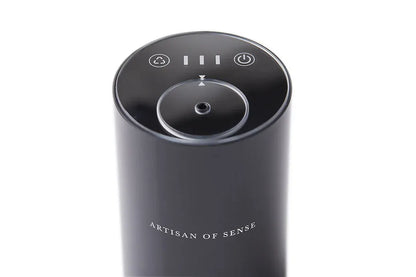Portable ultrasonic diffuser set in Pink, White, or Black, includes AOS Essential Oil Blend for on-the-go aromatherapy.