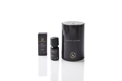 Aroma: Patchouli Orange Clove for Calm Distress. Concentrated essential oil in a dark glass vial.