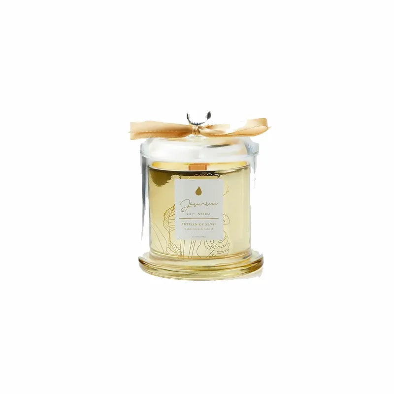Imagine the ambiance created by this soy candle with natural fragrances and crackling FSC wooden wick, beautifully displayed in a golden glass jar and covered by a clear cloche. A sustainable and delightful gift option. Scent: Jasmine . Lily . Neroli.