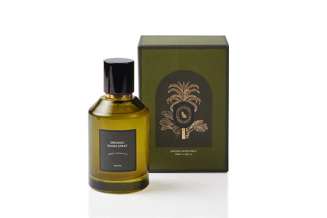 Botanical body and room mist in a luxury olive green glass bottle with black cap and gold detailing, blending Lemon and Eucalyptus essential oils. Synthetic-free, alcohol-free spray handcrafted in Singapore for clearing, invigorating aromatherapy across skin, linens, and living spaces.