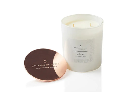 Musk, Bergamot & Rose scented soy candle in a white glass vessel, hand-poured at the Joo Chiat atelier