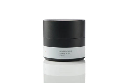 Compact tin candle with natural Patchouli Orange fragrance, cotton wick, for home comfort on the go. Offering a sensory journey for relaxation.