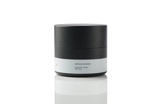 Compact tin candle with natural Patchouli Orange fragrance, cotton wick, for home comfort on the go. Offering a sensory journey for relaxation.