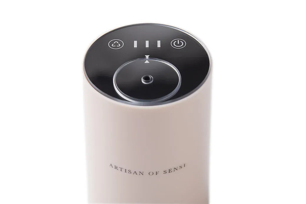 Portable ultrasonic diffuser set in Pink, White, or Black, includes AOS Essential Oil Blend for on-the-go aromatherapy.