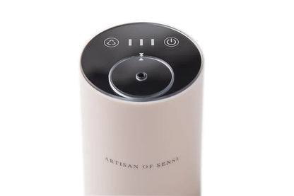 Portable ultrasonic diffuser set in Pink, White, or Black, includes AOS Essential Oil Blend for on-the-go aromatherapy.