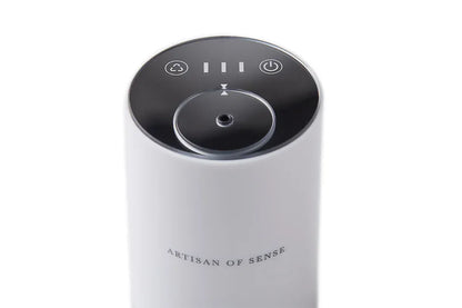Portable ultrasonic diffuser set in Pink, White, or Black, includes AOS Essential Oil Blend for on-the-go aromatherapy.