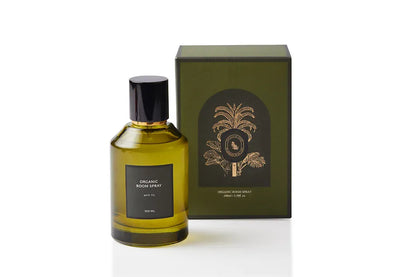 Botanical body and room mist in an elegant olive green glass bottle with black cap and gold accent, capturing green Wild Fig leaf and soft fruit. Alcohol-free, plant-based dual-purpose spray handcrafted in Singapore for lush Mediterranean warmth on skin, linens, and living spaces.
